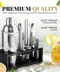 Ultimate Home Bar Mixology Kit With Stand 15 Piece Silver Bar Tool Set with cocktail glass on marble surface