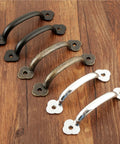 Assorted finishes of Vintage 85mm Drawer Knob Set For Cabinets And Dressers, 4 Pack Wooden Jewelry Box Pull Handles, Dope Decorative Furniture Hardware With Screws, Cool Modern Classic Kitchen Cupboard Pulls on a wooden surface.
