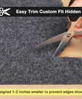 Close-up of 3 Ft Round Rug Pad No Slip Underlay For Hardwood Floors, being trimmed to size with scissors for custom fit