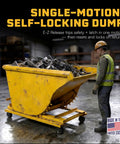 Built Tough 1.5 Yard Self Dumping Hopper With Smooth Rolling Casters And Six Thousand Pounds Capacity in warehouse filled with scrap metal.