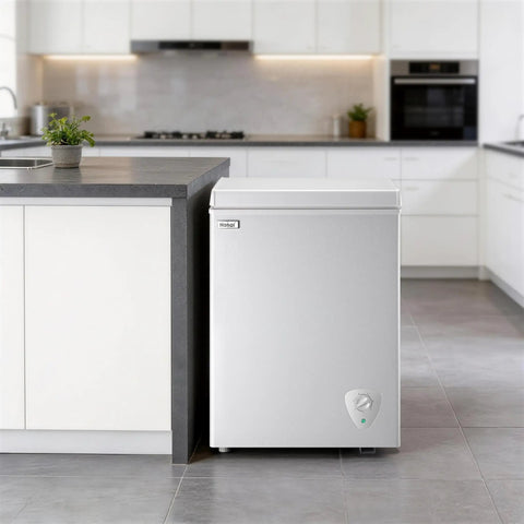 Compact Deep Chest Freezer Featuring 3.5 Cu Ft Capacity And Durable Storage Baskets White Cold Storage Appliance in modern kitchen.