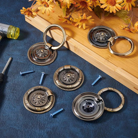 Antique Bronze Round Ring Drawer Pulls Set Of 8 Including Screws For Dresser Wardrobe Closet Bedroom Furniture Decoration Single Hole Mount 55x9mm Durable Rust Resistant Zinc Alloy Vintage Style Hardware displayed with blue screws, floral design.