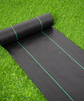 17 Inch Wide By 50 Feet Long Heavy Duty Landscape Fabric Weed Barrier Woven Geotextile Ground Cover rolled out on grass
