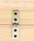 Close-up of 12 Pack Small Iron Chest Hinges Foldable Cabinet Door Hinges 60x13mm Reinforced Mini Box on wooden surface