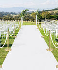 Lux Velvet Stanchion Rope White With Gold Hooks Five Foot Crowd Control Barrier For VIP Parties And Event Decor in garden setting