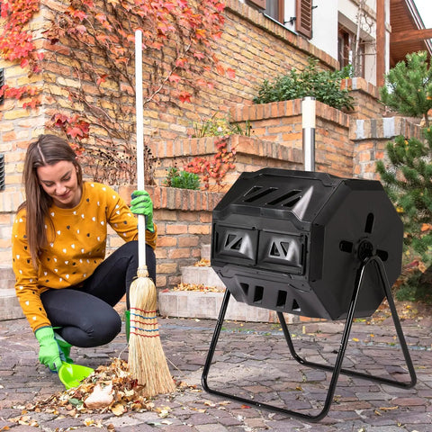 Heavy Duty 42 Gallon Dual Chamber Outdoor Compost Tumbler with Sliding Doors shown in garden setting with person raking leaves