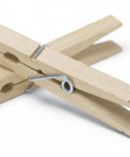 Natural Wood Clothespins 50 Pack Built Different Heavy Duty Wooden Clips with rust-resistant springs stacked at an angle.