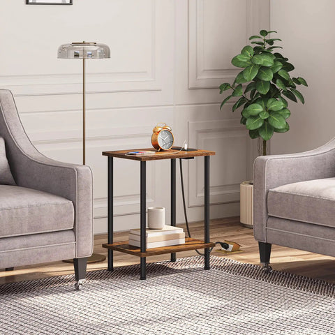 Super Handy End Table With Built In Charging Station And USB Port Type C Outlet For Nightstand Use In Small Spaces Rustic Brown Two Shelf Side Table For Living Room Or Bedroom With Stable Frame shown between two armchairs in a cozy living room setting.