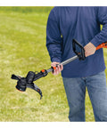 Person holding 40V Max Cordless String Trimmer And Edger With Telescoping Pole Two In One Weed Wacker For Lawn Care PowerCommand Dial