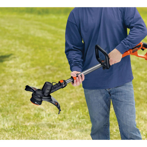 Person holding 40V Max Cordless String Trimmer And Edger With Telescoping Pole Two In One Weed Wacker For Lawn Care PowerCommand Dial