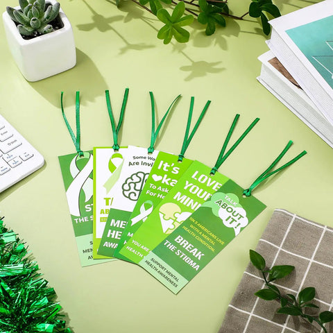 Must Have 120 Pack Mental Health Awareness Bookmarks With 6 Styles, Double Sided Designs Plus 120 Green Ribbons displayed on desk