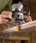 Router Bit Set Half Inch Shank, 35 Piece Kit For Woodworking being used on wooden plank with carpenter for sharp edges and smooth finishes.