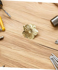 Vintage Brass Flower Cabinet Handle Single Hole Drawer Pull For Wardrobe And Cupboard Doors shown with tools