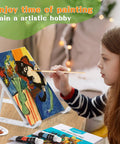 Child painting on canvas using All In One Acrylic Painting Set With 24 Vibrant Paints 8 Brushes 5 Canvas Panels Wooden Stencils