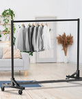 Industrial Grade Z Base Garment Rack with Beefy 500 Pound Capacity and 63 Inch Extra Long Bar Black Finish in living room