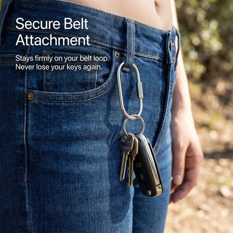 Person wearing Durable Silver Stainless Steel Carabiner Key Ring With Secure Screw Lock on belt loop, holding keys.