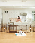 Super Wide 192 Inch Baby Gate And Play Yard System in kitchen, brown, encloses baby, 6 panel hardware mounted gate.