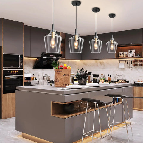 Modern Black And Gold Glass Pendant Light 2 Pack With Adjustable Height Cord For Kitchen Island Clear Round Shade E26 Socket above a kitchen island.