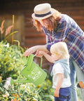 Best Mom Gift Set For Mothers Day From Daughters Floral Garden Tool Kit with green watering can in use by mother and child