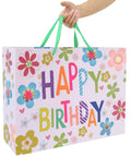 Sixteen Point Five Inch Extra Large Colorful Happy Birthday Gift Bag Set With Handles showing floral design, held by hand
