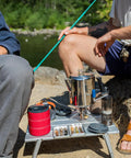 Stainless Steel Percolator Coffee Pot With Silicone Handle For Camping And Travel Stove Safe 6 Cup Campfire Brew in use by campers