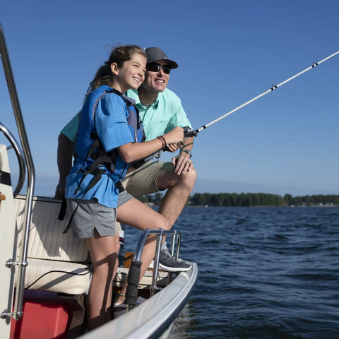 Two people fishing on a boat with Portable 12 Gallon Marine Gas Can under seat, lake in background