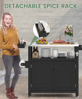 Front view of a black Weatherproof HIPS Outdoor Kitchen Island with stainless steel top, spice rack, and storage cabinet.