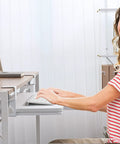 Woman using Under Desk Keyboard Tray With Clamp On Mount 19.7 By 11.81 Inches Space Saving Pull Out Keyboard Drawer in home office
