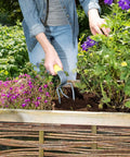 Person using Hand Tiller Garden Claw Set With Garden Twist Tiller And Small Soil Tiller For Raised Beds And Flower Boxes Heavy Duty.