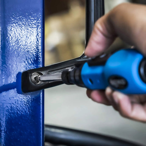 Cordless Power Screwdriver With Auto Lock One Quarter Inch Hex Chuck in action tightening a screw on a blue metal surface