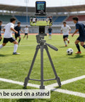 4-In-1 Universal Fence Mount Kit With Tripod Adapter For Recording On The Go Compatible With Pocket Radar GoPro iPhone Mevo Start Insta360 And More On Baseball Softball Tennis Football Chain Link Fence installed on tripod capturing soccer game