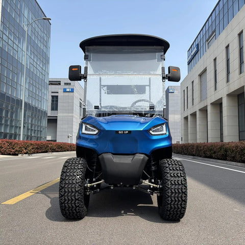 Heavy Duty Electric Golf Cart With Four Kilowatt Motor And Easy Directional Controls front view in urban setting with large tires.