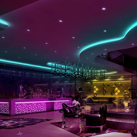 Colorful room lit with Waterproof Led Strip Lights 32.8 Ft Two Rolls Of 16.4 Ft Color Changing 300 LEDs, showing ceiling design