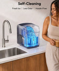 Fresh Freeze Countertop Nugget Ice Maker Yields 42 Lbs Soft Sonic Pebble Ice In Minutes With Smart App Alexa Hookup Self Cleaning, displayed in a kitchen with water flow.