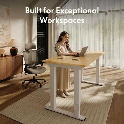 Premium Four Leg Height Adjustable Standing Desk With Natural Maple Surface And Rock Solid Anti Wobble Engineering For No Stress Home Office And Multi Monitor Setups in a modern workspace