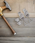Heavy Duty Toggle Clamp Latch With Adjustable Lock Hole Stainless Steel Kit on wooden surface with hammer.