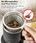 Reusable stainless steel filter shown above a mug with herbal tea, emphasizing no microplastics in the brewing process.
