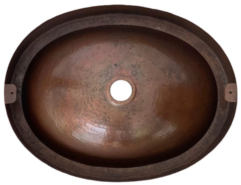 16 By 13 Inch Oval Skirted Vessel Copper Sink Hand Hammered Pure Copper Brown Finish For Modern Bath Semi Recessed Vessel One And A Half Inch Drain Opening Eighteen Gauge Handmade In Mexico CPS10 showing top view of hand-hammered patina interior.