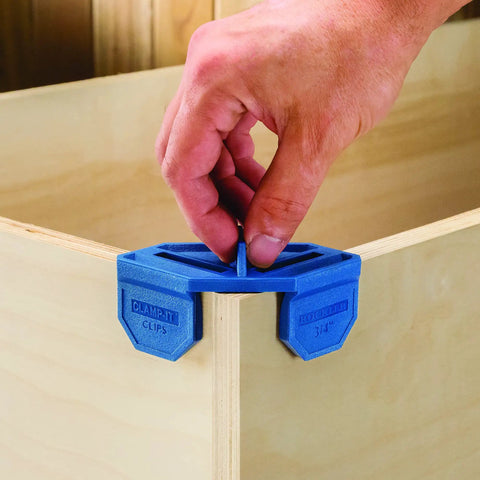 Using Blue Three Quarters Inch Corner Clamp Clips Four Pack For Woodworking on wooden panel