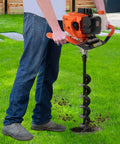 Person using Gas Powered Earth Auger Post Hole Digger 52cc Two Stroke With 1 Extension Rod And 3 Auger Bits in a garden