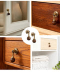 Antique Tear Drop Walnut Drawer Pulls Set Two Pack With Screws shown on various cabinets and furniture.