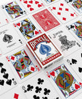 Standard Two Pack Playing Cards In Red And Blue Optimized For Tight Fan And Buttery Smooth Shuffle Heavy Duty Stock on table.