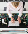 Person using Huge 4-In-1 XXL Desk Pad Set With Wrist Rest, Gaming Mouse Pad, Keyboard Wrist Pad, Mouse Pad Wrist Support And Cup Coaster, Floral Ergonomic Desk Mat for office use.
