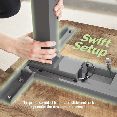 Heavy Duty Dual Motor Electric Standing Desk With Smooth Height Adjustment And Killer Ergonomic Wrist Relief Edge Built On A Solid Frame With Top Shelf Reclaimed Wood Top In Slate For Home Office during assembly process.