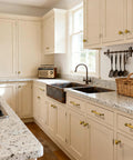 10 Inch Antique Brass Cabinet Pulls on kitchen cabinets with flat brushed brass finish, zinc alloy handles installed on cream cupboards