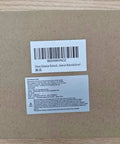 Cardboard box packaging for 35mm Concealed Hinge Jig, showing label and barcode on wooden background.