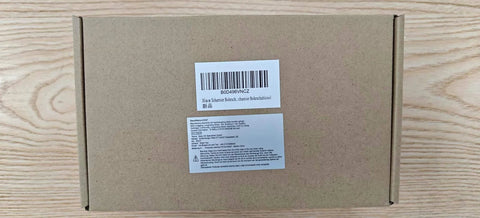Cardboard box packaging for 35mm Concealed Hinge Jig, showing label and barcode on wooden background.
