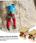 Beefy Two Pack Heavy Duty Sliding Door Pulley Block With Steel Wheel Track Roller for Gates and Shutters shown next to rock climber.