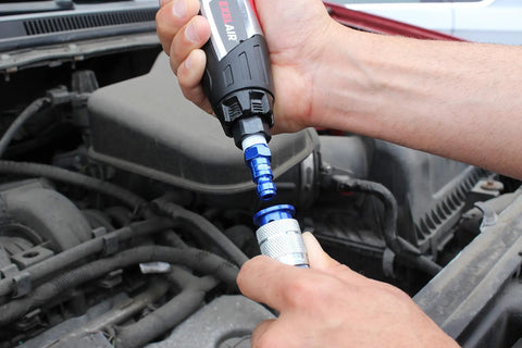 Hands connecting Blue T Style Pneumatic Plugs One Quarter Inch NPT Female Box Of Twenty Easy Push To Connect Color Coded Air Line Fittings