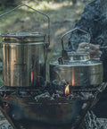 1.2L Stainless Steel Camping Pot with lockable lid for bushcraft and campfire cooking on open fire with kettle.